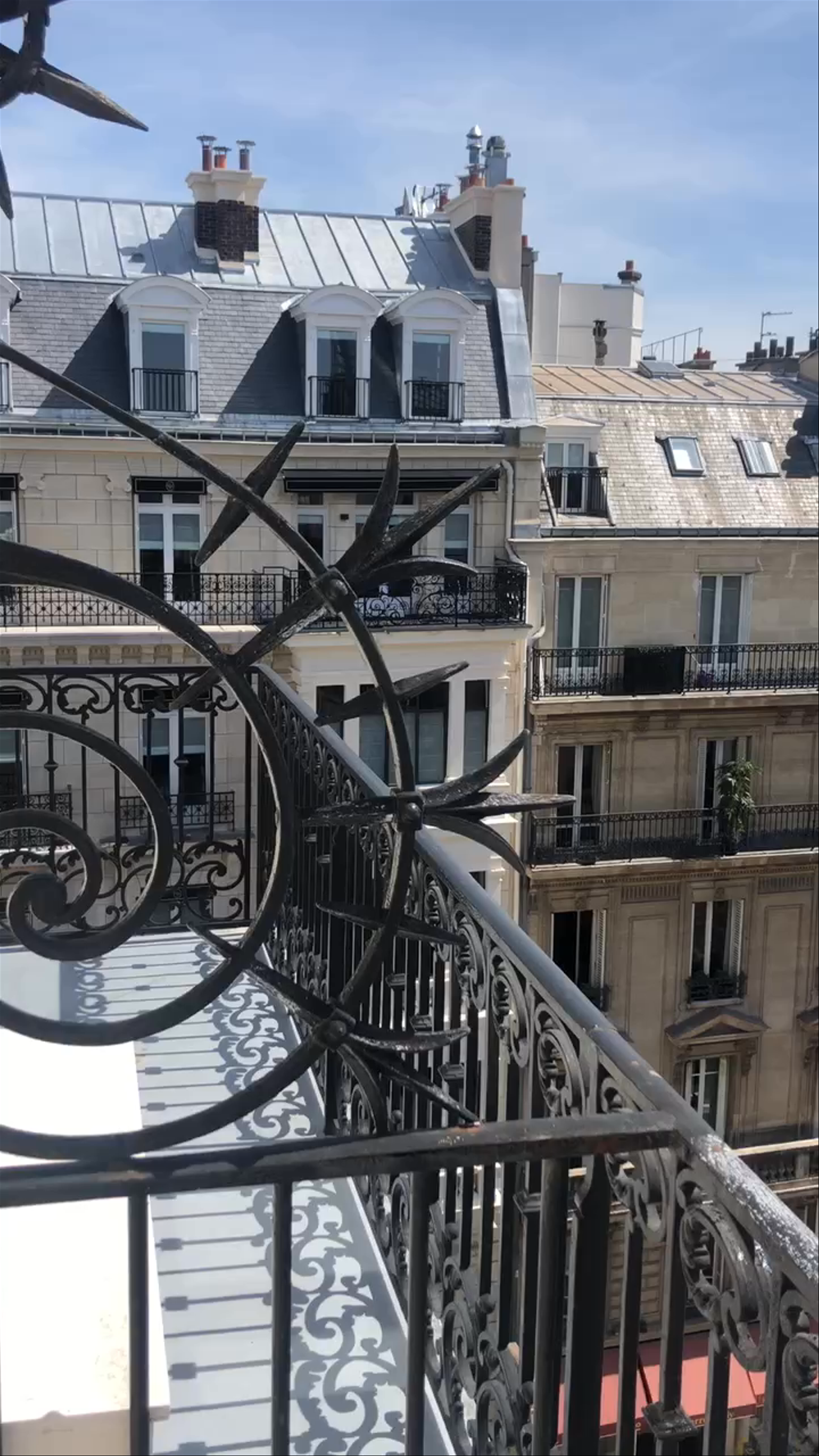Sunlit Parisian Balcony View with Eiffel Tower