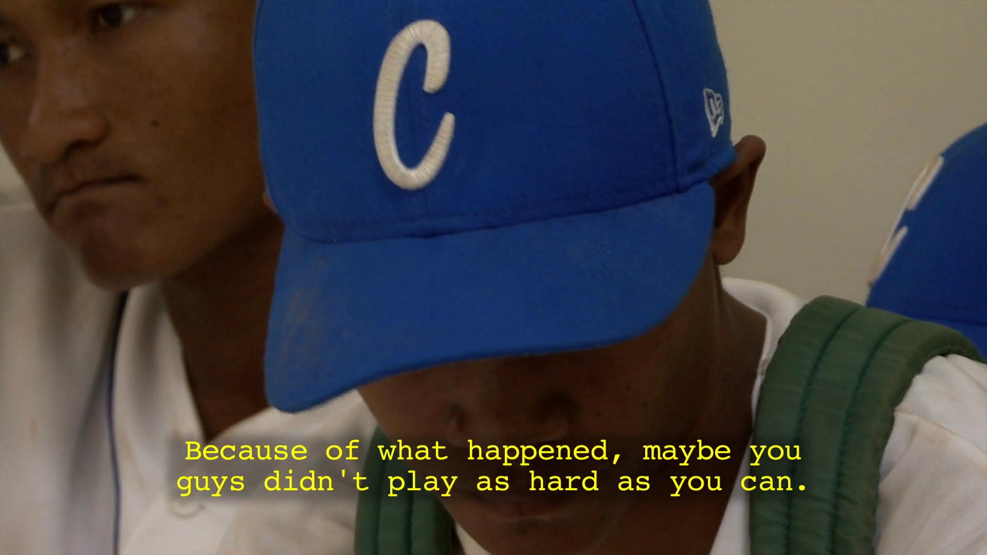 A coach addresses a baseball team, discussing challenges faced during a recent game and reflecting on his decision-making process. The discussion focuses on performance and overcoming feelings of disappointment among the players.