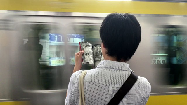 Reading a comic whilst waiting for the subway