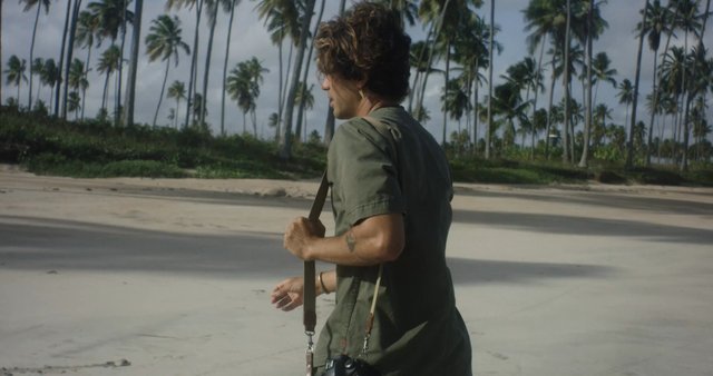 Man walking on a tropical beach