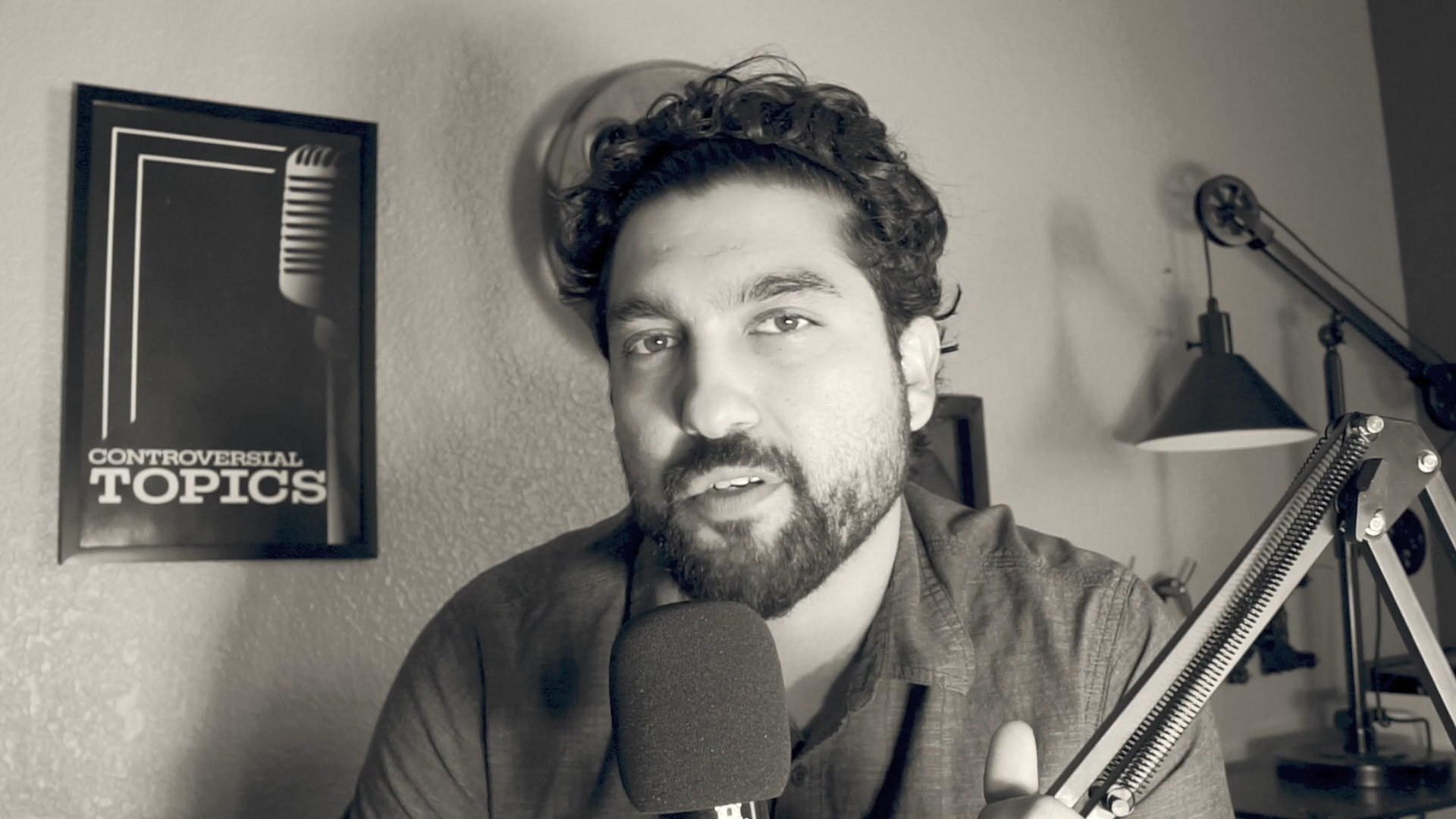 A podcast host reflects on a poignant final interview featuring an individual named Eric. The host delivers a direct-to-camera commentary set against a studio backdrop.