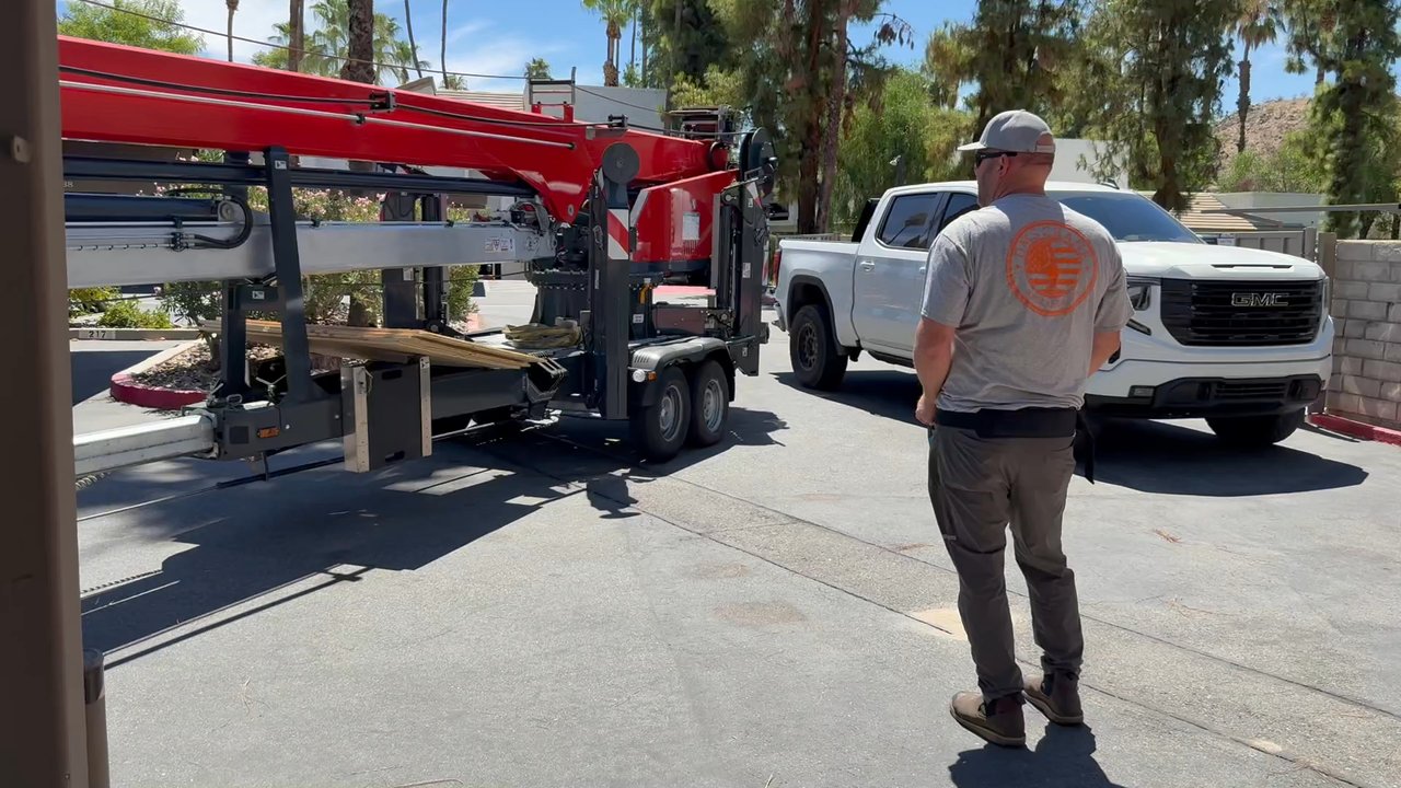 DMS Crane Service - Driving the crane with remote control to destination - Crane Services Near Me