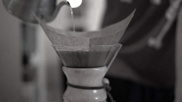 Pouring water into a coffee machine
