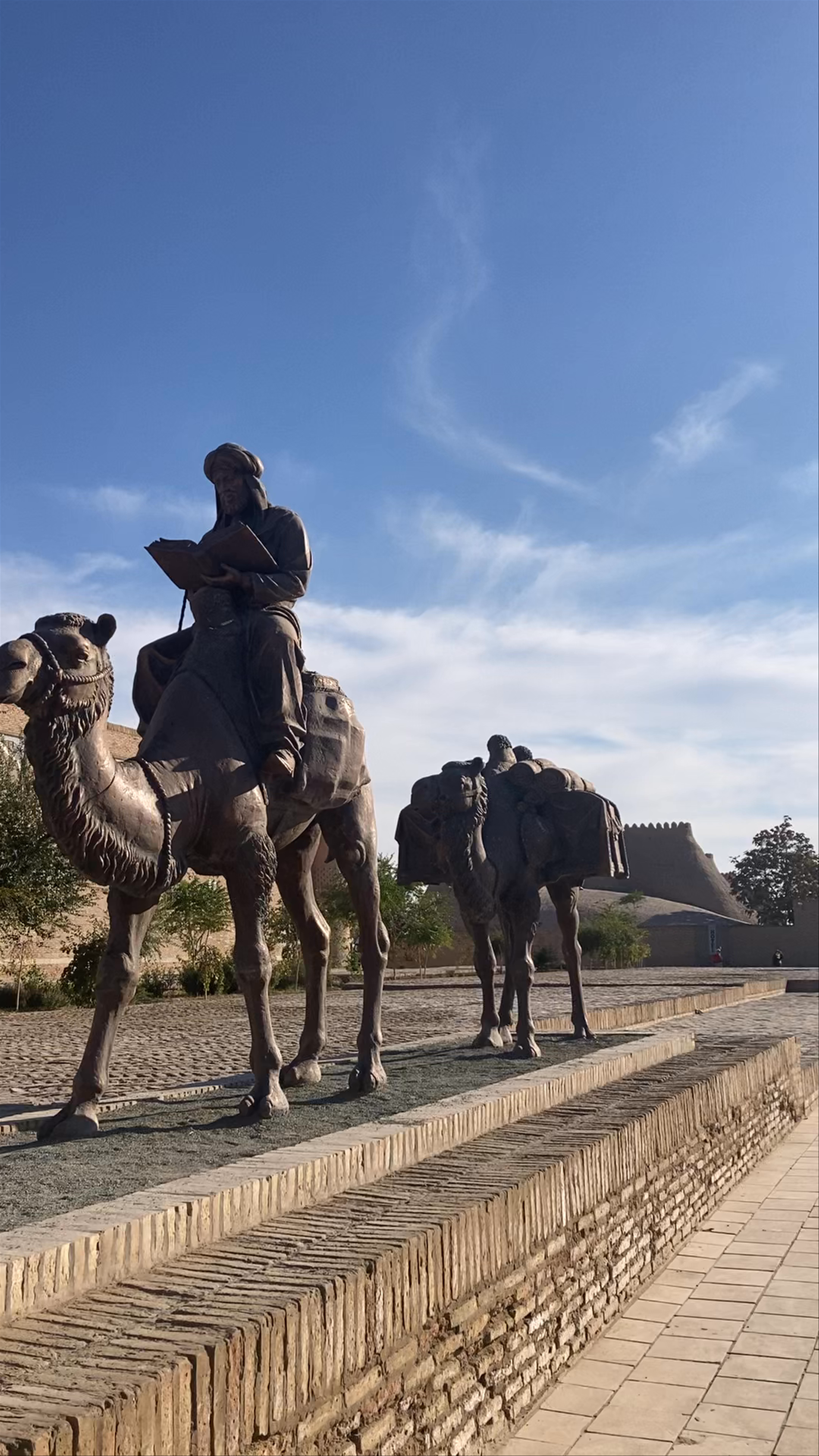Itchan Kala West Gate: Ancient Caravan Statues in Khiva, Uzbekistan