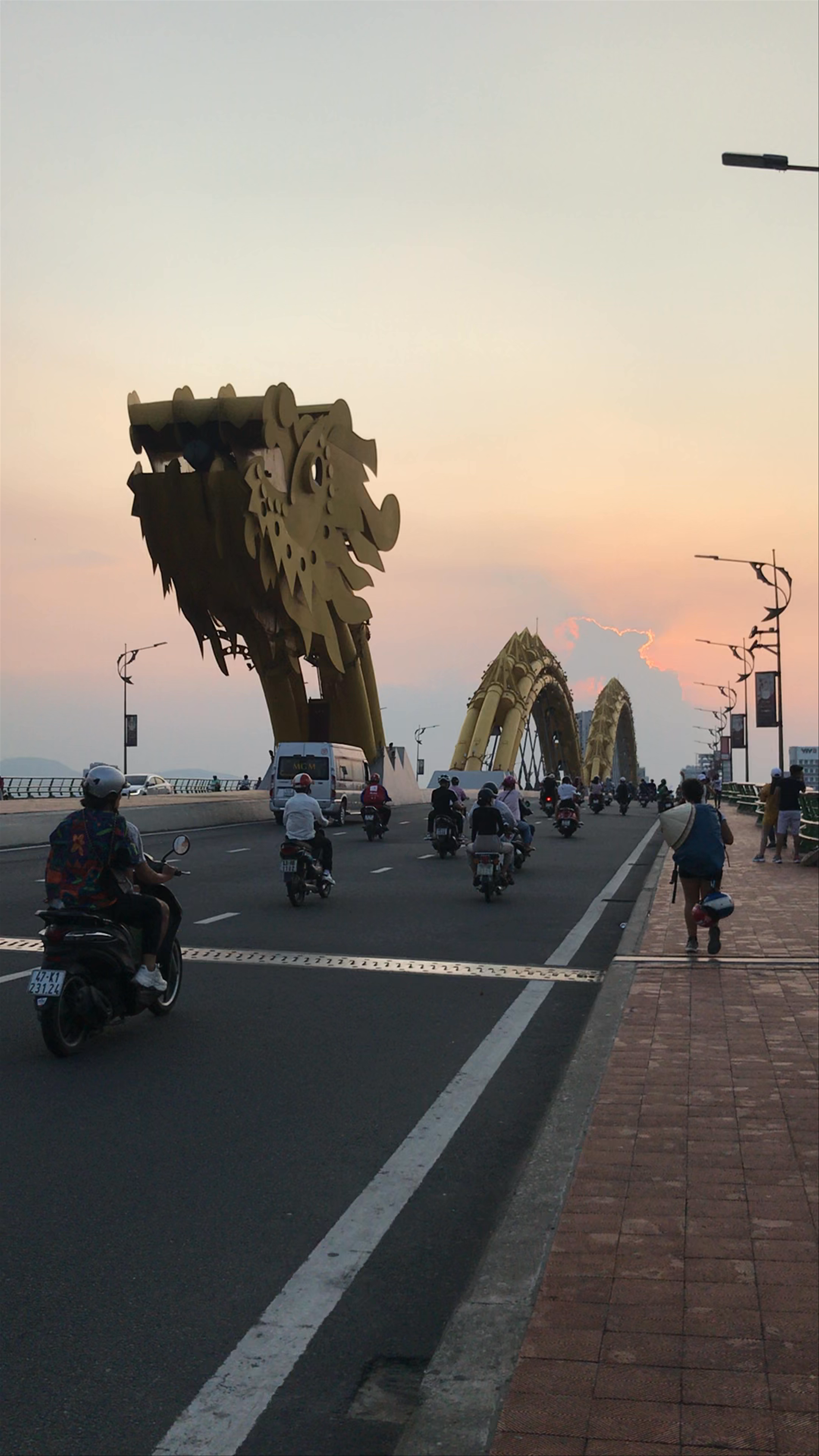 Dragon Bridge at Sunset: Vibrant Life in Da Nang, Vietnam
