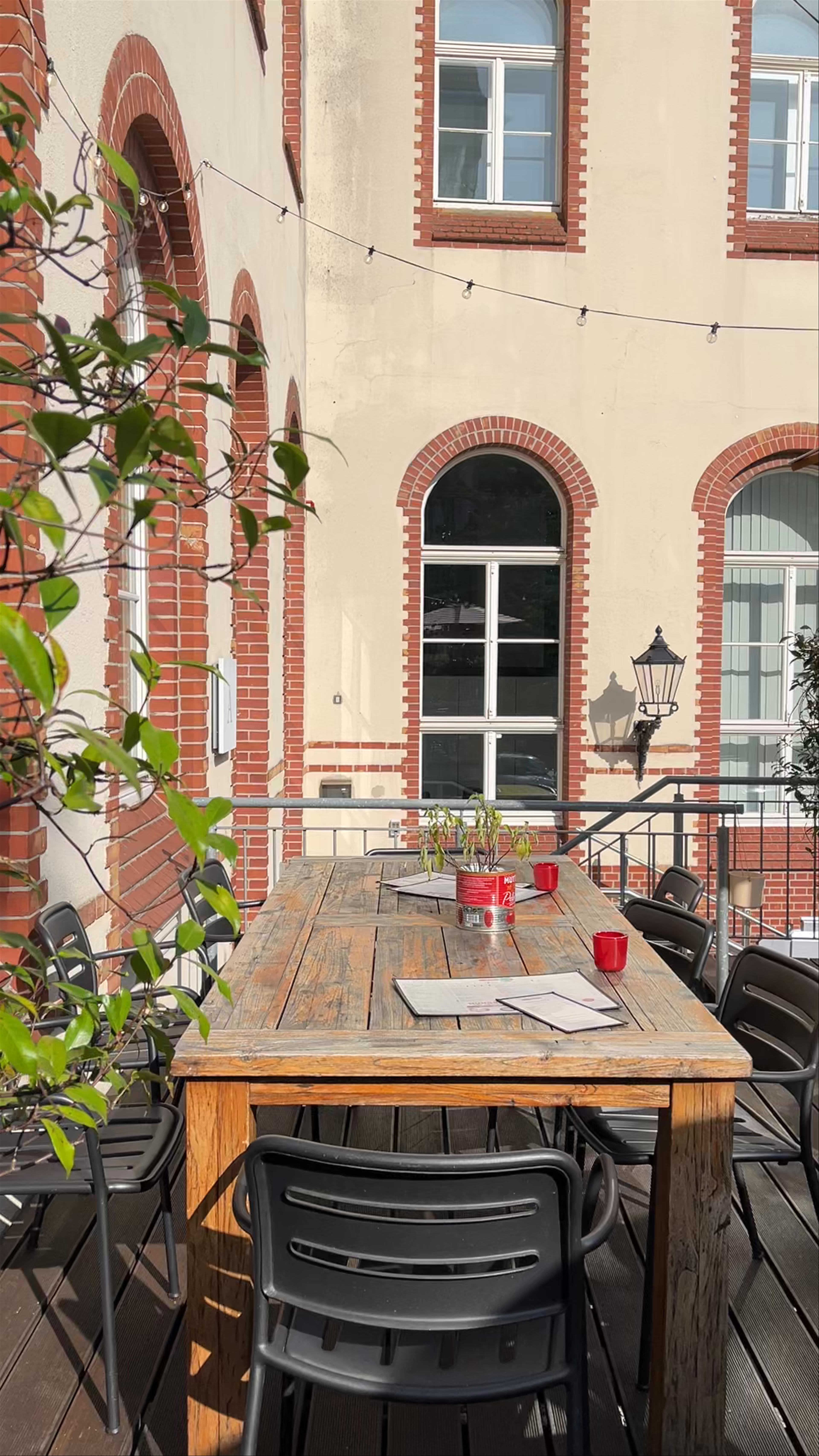 Sunlit Terrace Dining at L'Osteria Oldenburg