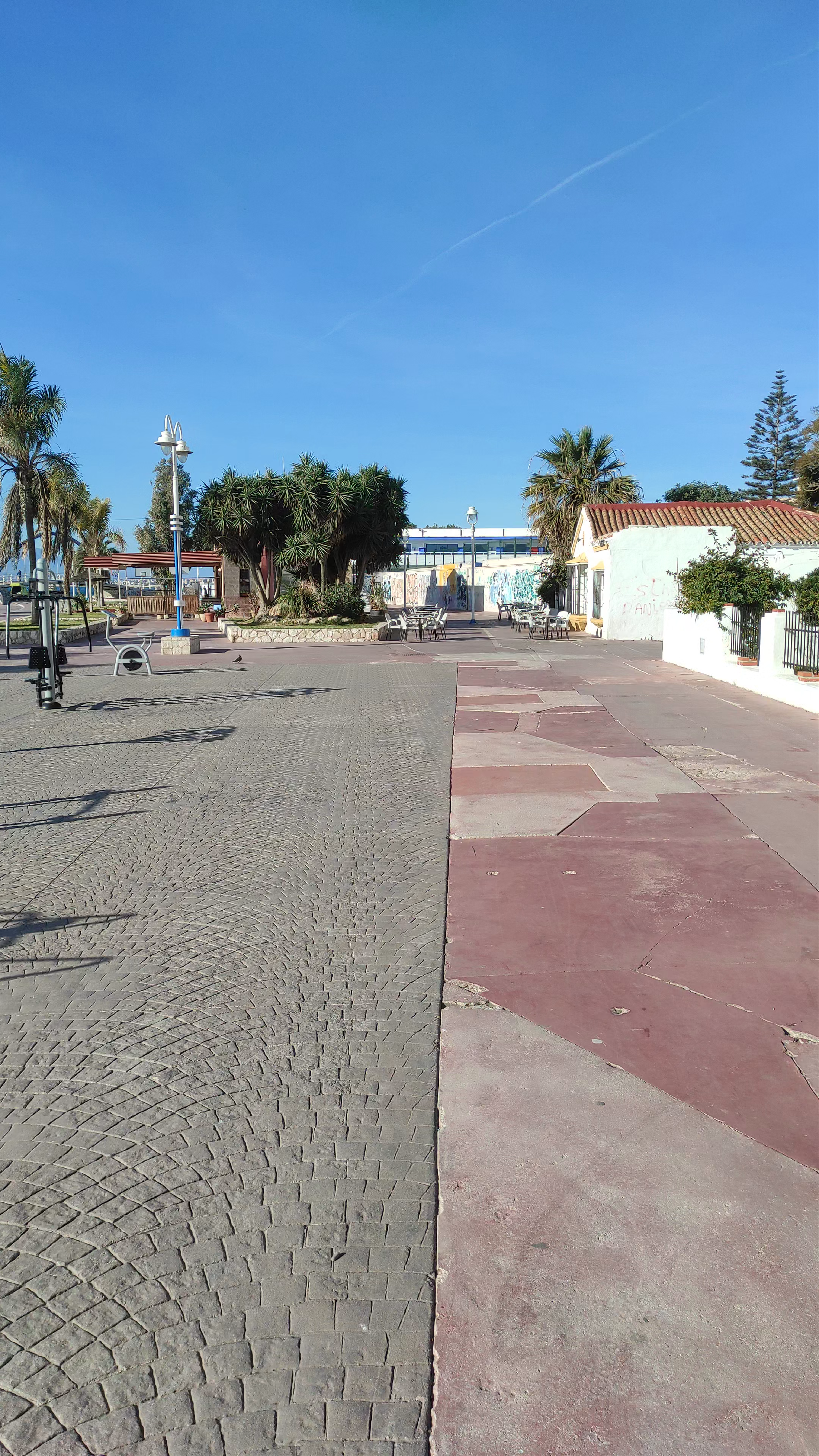 Sunny Seaside Stroll at Plaza Virgen Milagrosa, Málaga