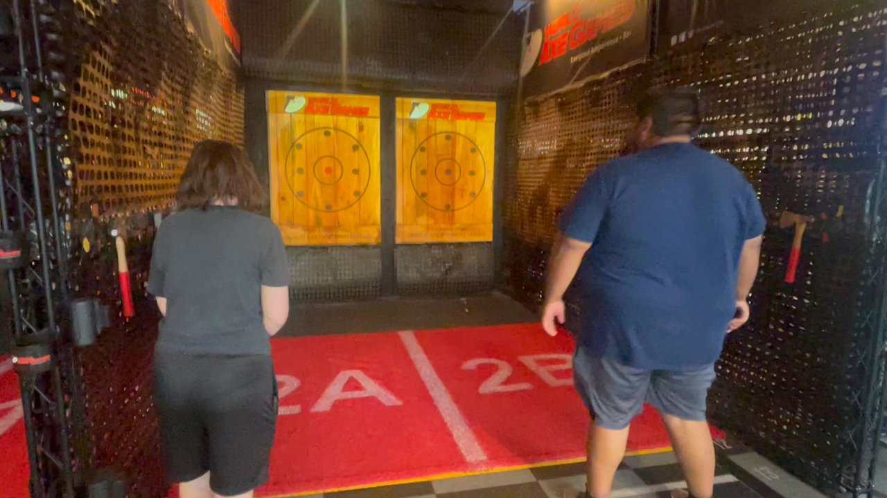 World Axe Games - The projection and the games that they have, Chase the bull game, one of the many games to play from! - Sports Bars Near Me - Hurst, Texas