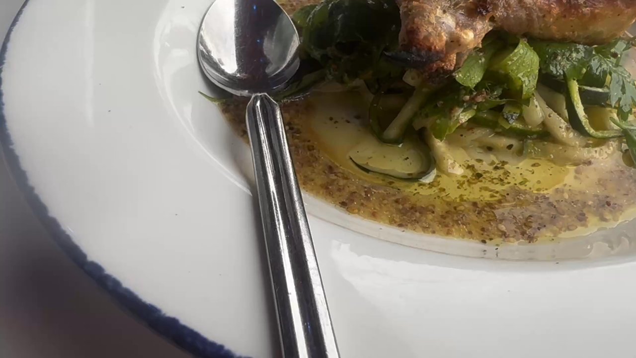 Extra Virgin - Duck Leg Confit over a bed of sprouts with extra spicy sauce on the side, ROASTED BRANZINO - Tapas/Small Plates Near Me - Kansas City, Missouri