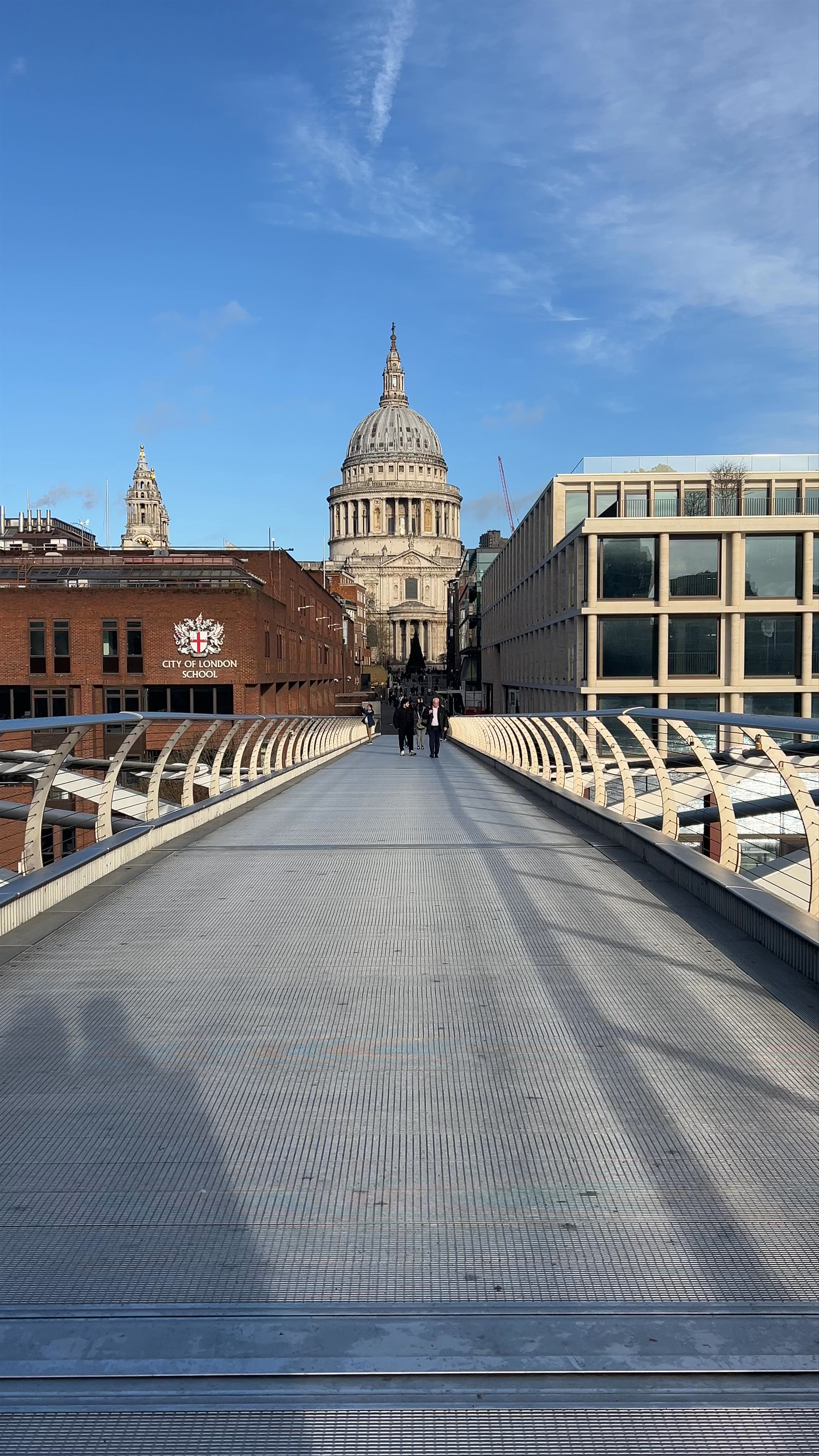 Walking Across Millennium Bridge with a Stunning View of St. Paul's Cathedral, London