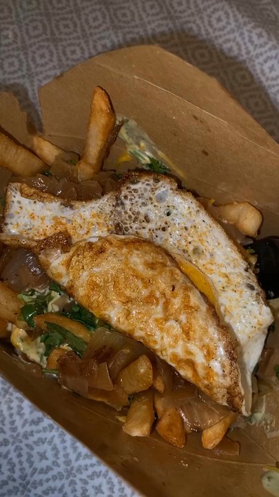 The Great White Hut - Fries with grilled onions, chedder cheese, cilantro and sunny side up egg on top. Avocado cream and garlic aoli sauces. - Burgers Near Me - Sunland, California