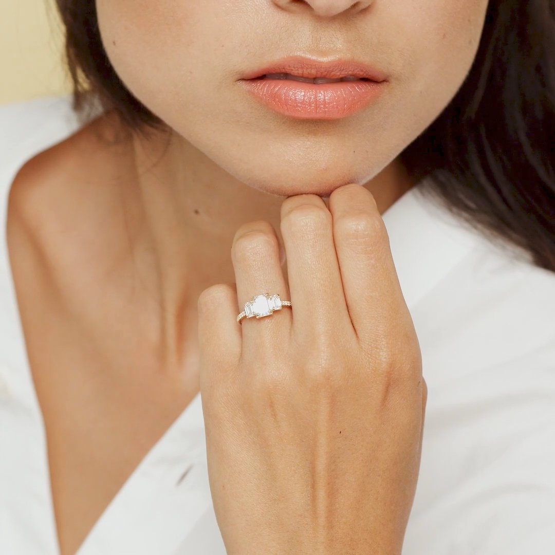 The Three Stone | Emerald | Platinum | bandAccent: Pavé | sideStoneCarat: 0.25ct | sideStoneShape: Emerald | diamondOrientation: vertical | caratWeight: other