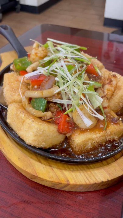 Uncle Chin's Kitchen - Sizzling tofu in action! - Malaysian Near Me - Katy, Texas