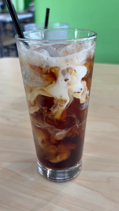 The Toasted Yolk Cafe - Cold brew added hazelnut and some half and half - Breakfast & Brunch Near Me - Addison, Texas