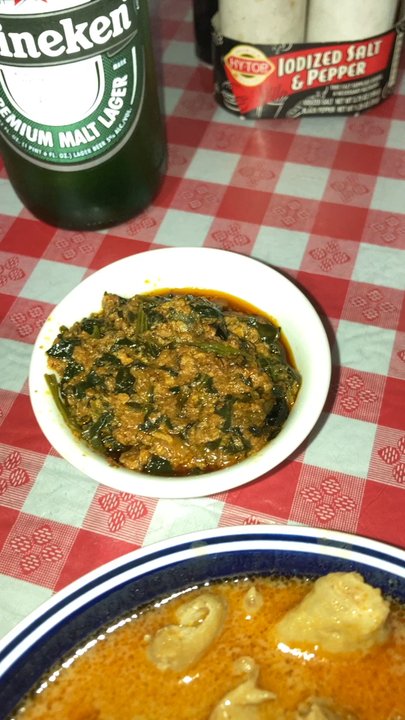 Afrikiko Restaurant - Tonight's spread: plantain fufu, groundnut soup with chicken, spinach on the side, Heineken to wash it down! - African Near Me - Houston, Texas