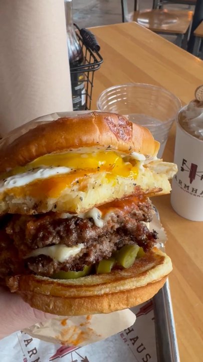 Farmhaus Burger - Absolutely dripping with yolk, cheese, and juices... - Burgers Near Me - Augusta, Georgia