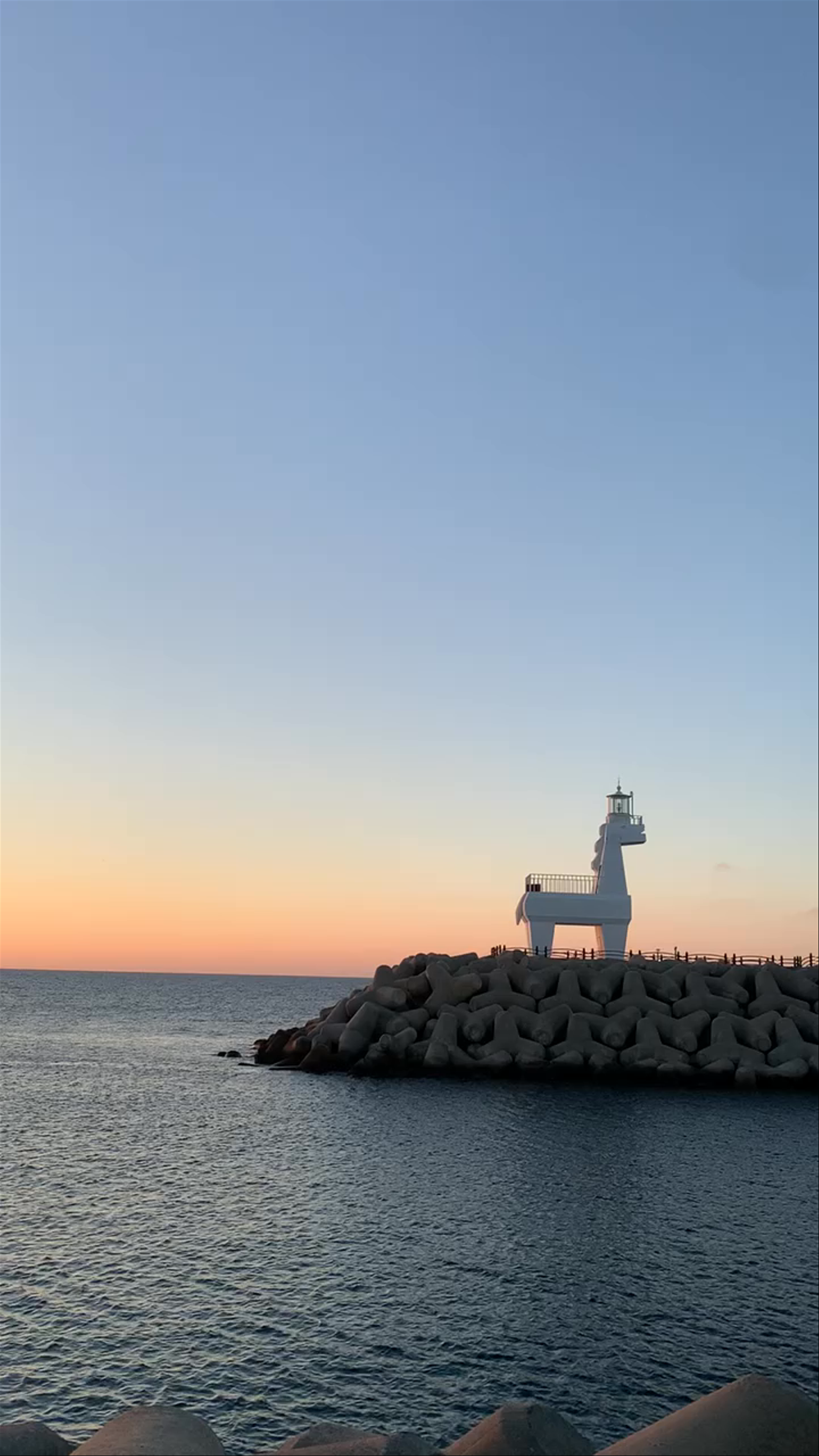 Red & White Horse-shaped Lighthouse at Sunset, Jeju Island