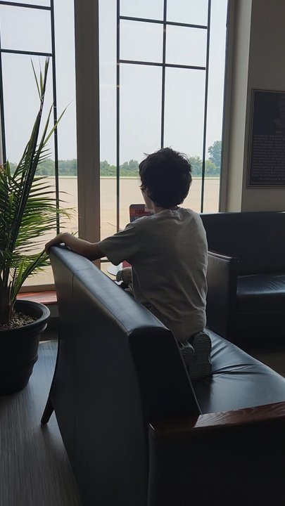 Pilot Pete's - After seeing a plane zoom past us, My son anxiously awaits seeing another one. - American Near Me - Schaumburg, Illinois