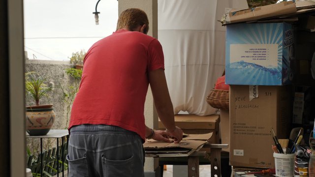 Man cutting cardboard