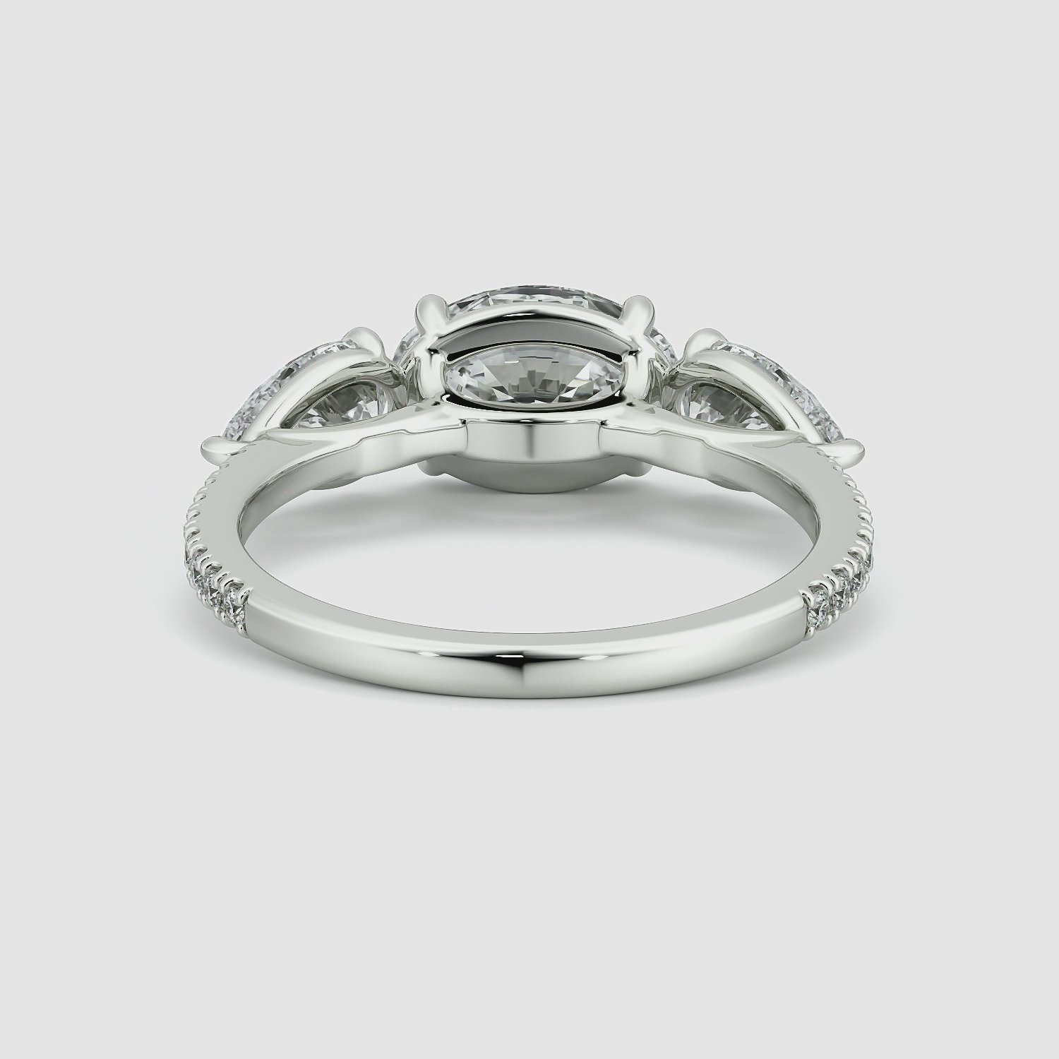 The Three Stone | Oval | 18k | White Gold | bandAccent: Pavé | diamondOrientation: horizontal | sideStoneCarat: 0.50ct | sideStoneShape: Pear | caratWeight: other