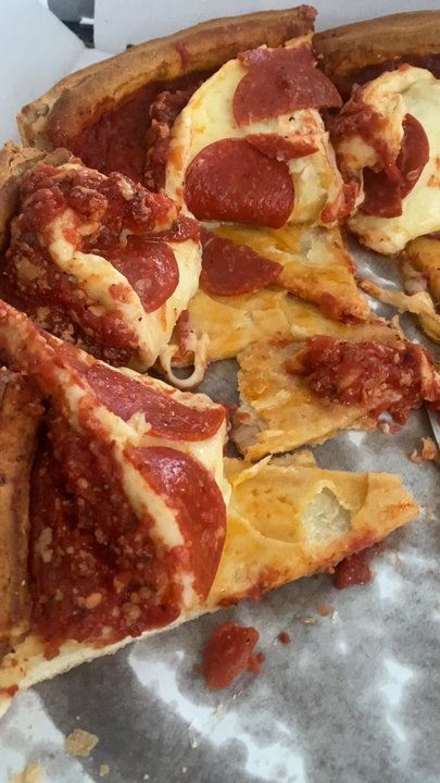 Giordano's - Video proof. It was difficult to peel the cheese w/our wrecking the deep dish stuffed pizza. Then we put it together so people can eat it. - Pizza Near Me - Buffalo Grove, Illinois