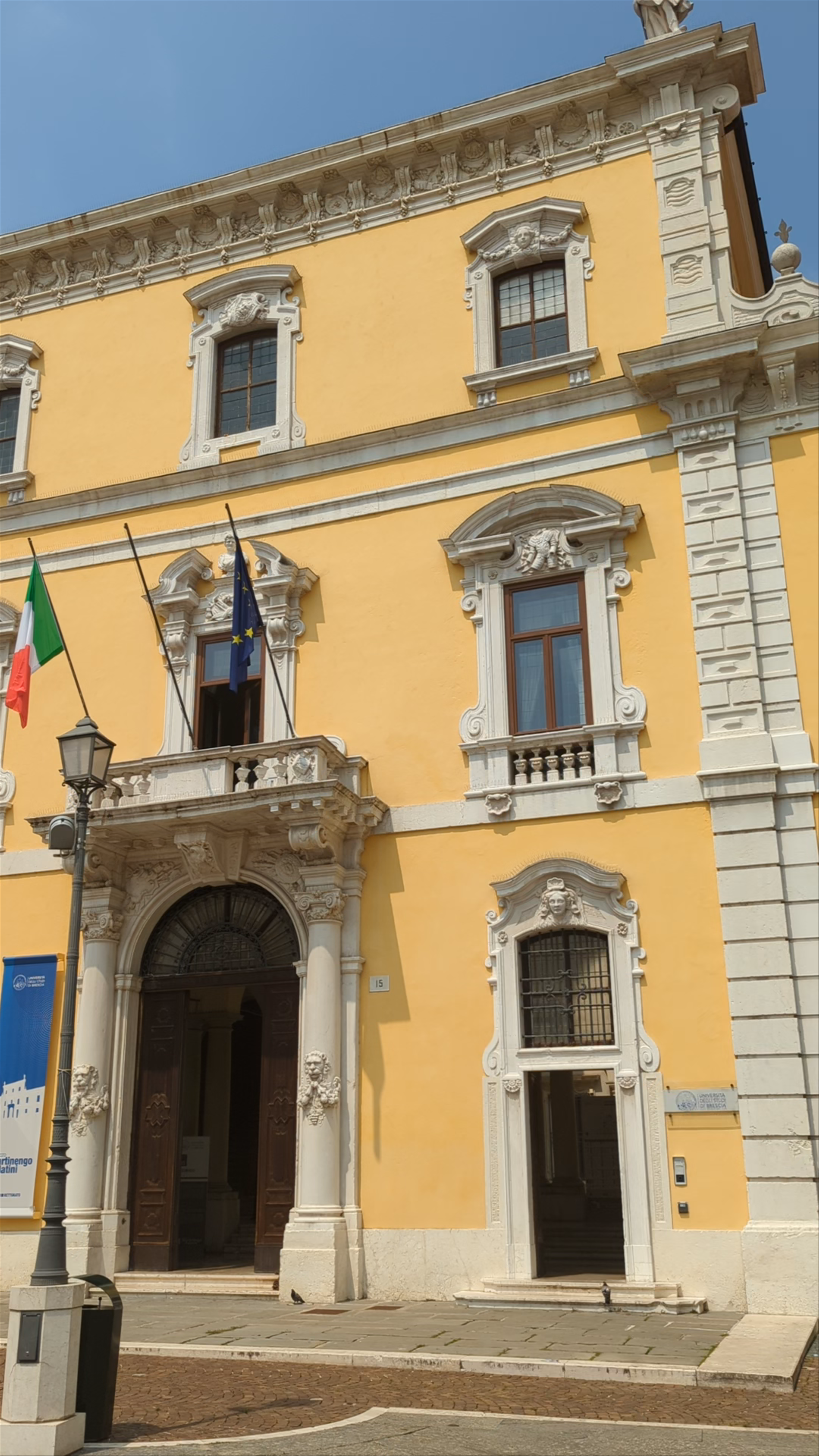 Sunlit Stroll Through Piazza del Mercato in Brescia, Italy
