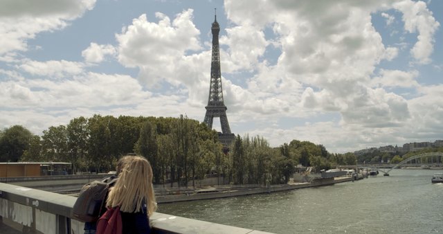 People on a bridge near Eiffel Tower 