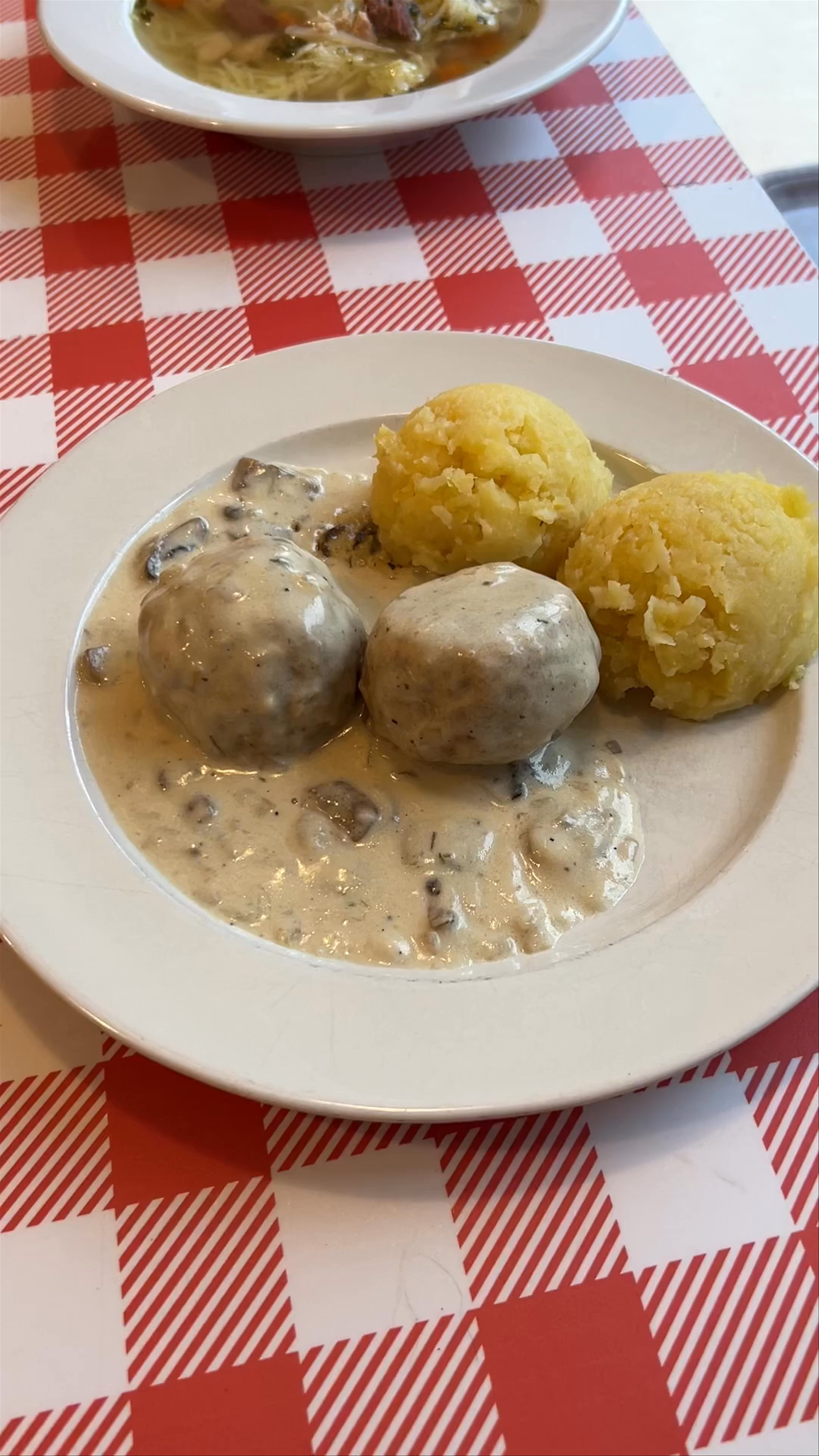 Traditional Polish Comfort Food: Dumplings in Creamy Mushroom Sauce in Warsaw