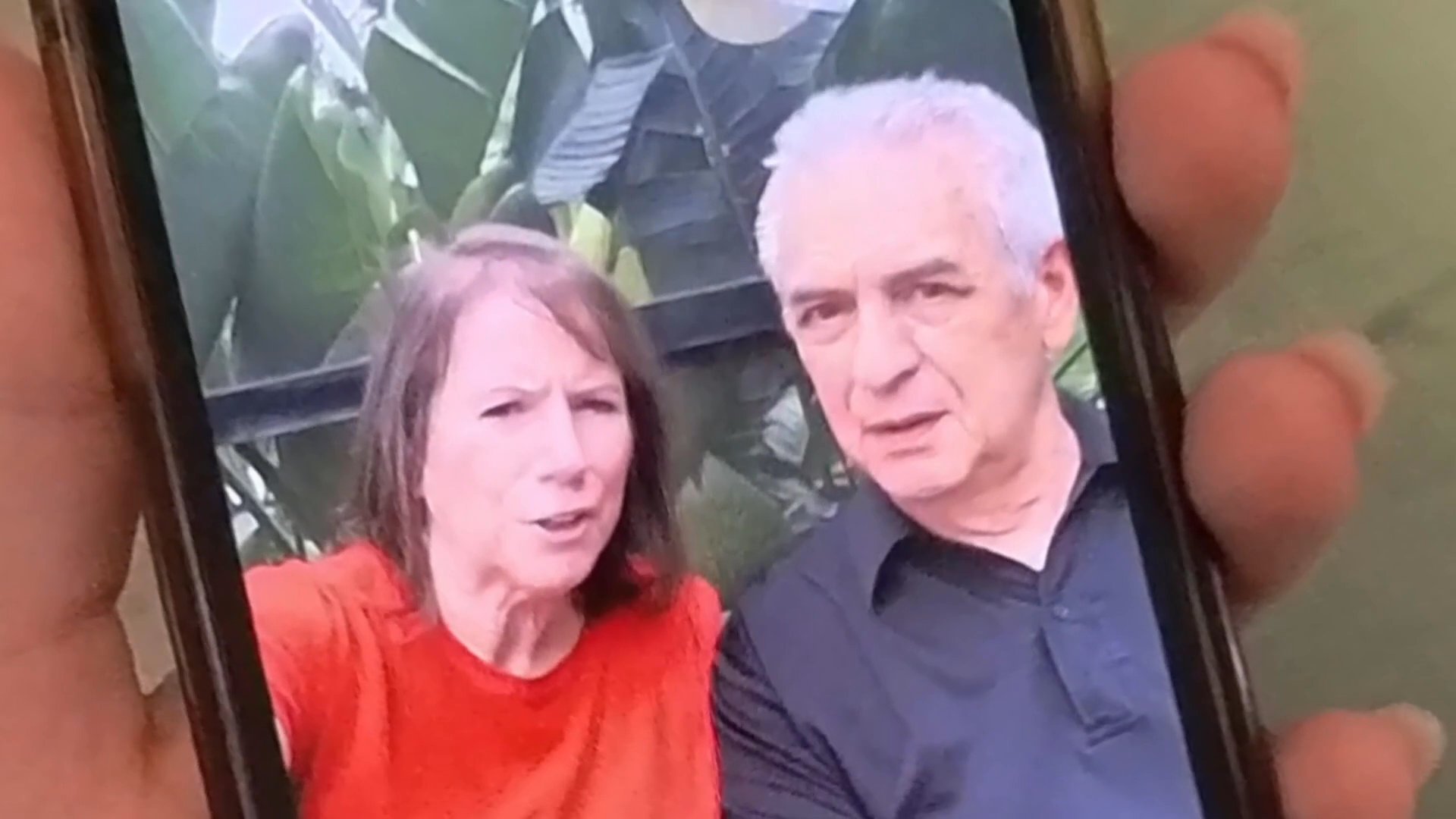 A woman engages in an emotional video call with older family members on her smartphone before reflecting on the conversation while lying in bed.