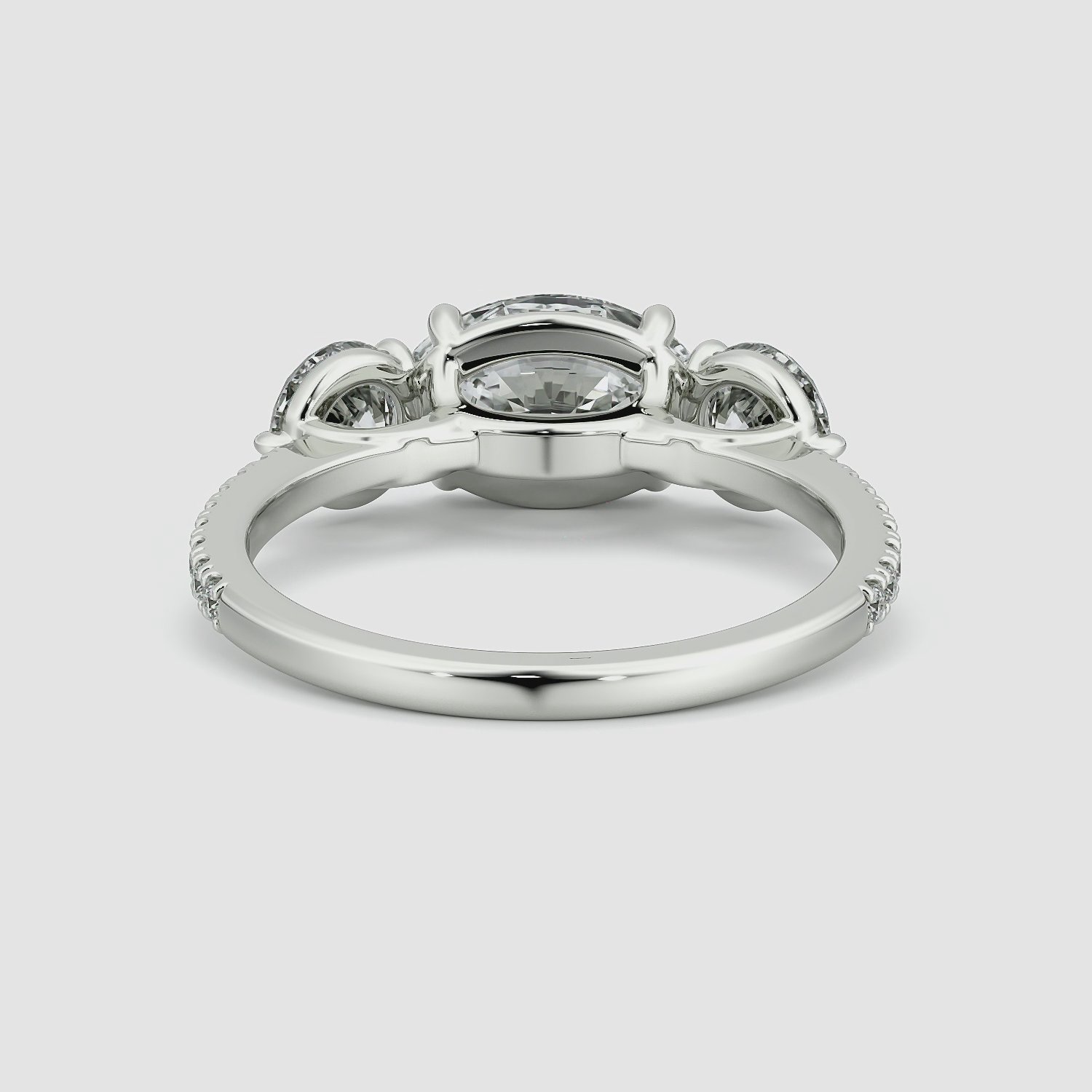 The Three Stone | Oval | 18k | White Gold | bandAccent: Pavé | diamondOrientation: horizontal | sideStoneCarat: 0.50ct | sideStoneShape: Round Brilliant | caratWeight: other