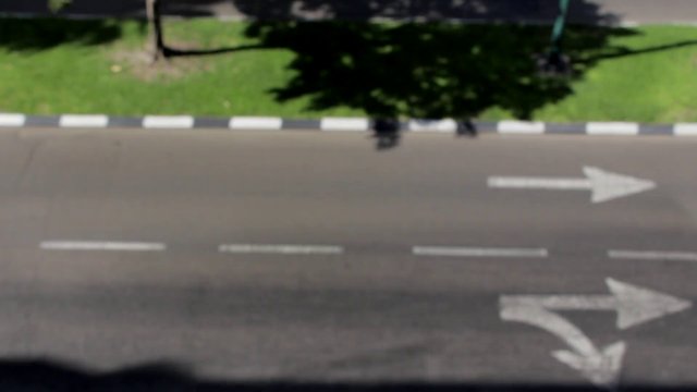 Cars driving over road arrows