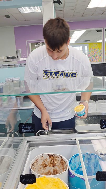 Sips and Scoops - A Video Clip of my server Chase preparing and serving my scoop of Mango Ice Cream in a cup. Excellent and efficient customer service. - Ice Cream & Frozen Yogurt Near Me - Cave Spring, Virginia
