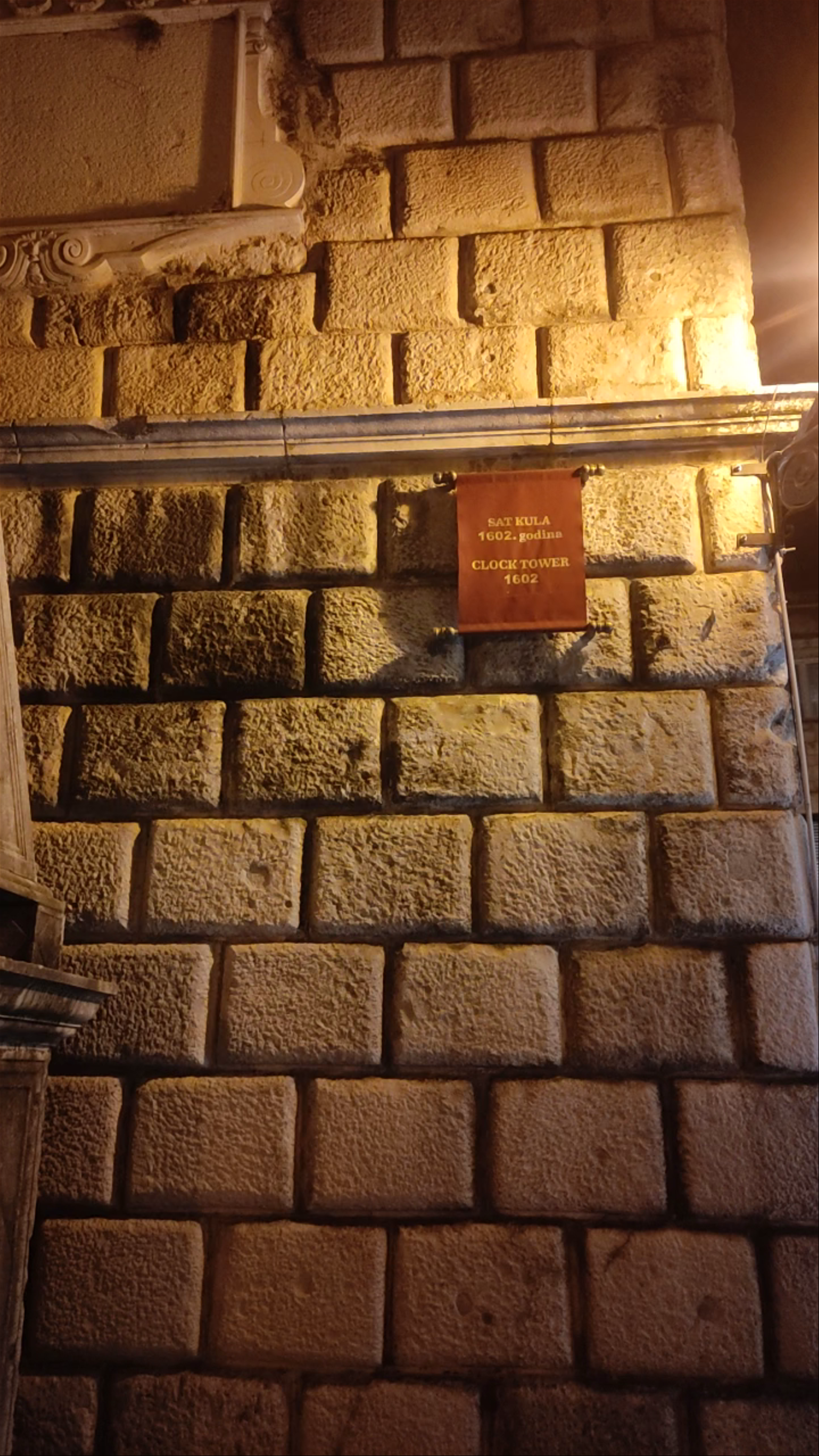 Torre del Reloj: Historic Nighttime Charm in Kotor's Square of the Arms