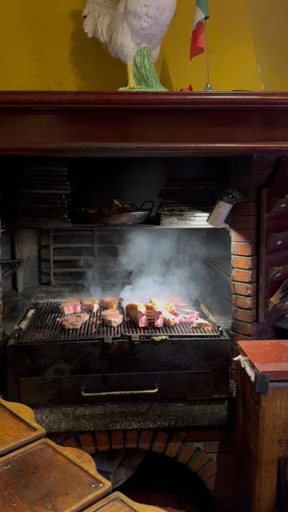 Ribot - Meat cooking on the grate. Wonderful aroma. - Steakhouses Near Me - Milan, Michigan