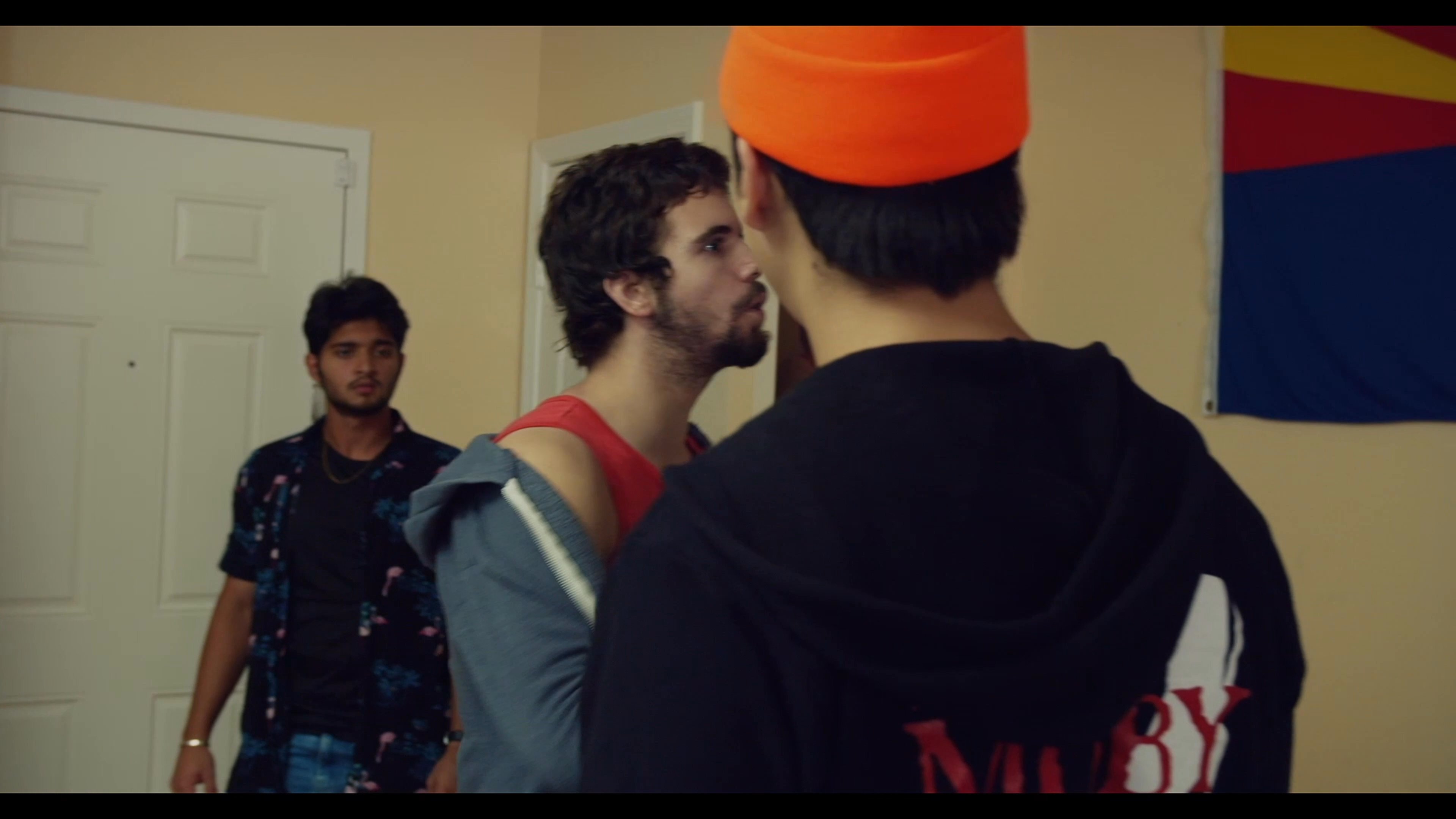 Two individuals engage in an intense verbal confrontation within a residential setting, marked by clear interpersonal tension and disagreement.