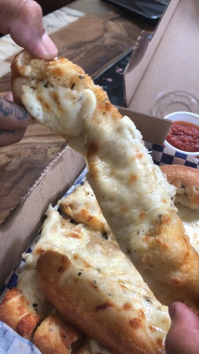 Dan's Pizza - Pfffff well try it for yourself you don't believe me! With pizza sauce dip not marina! Side of garlic butter if you're super badddd. - Pizza Near Me - Houston, Texas