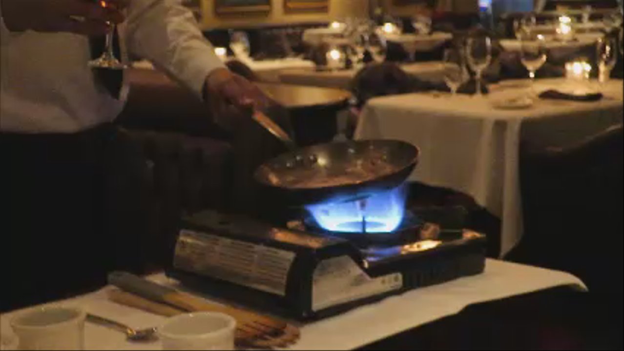 Duke's Steakhouse - flaming spinach salad dressing prep - Steakhouses Near Me - Carson City, Nevada
