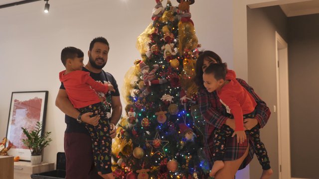 Happy family near a Christmas tree