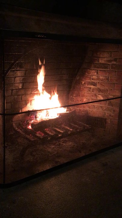 Red Fox Bar & Grille - The beautiful fire next to our table. Apparently every staff member has to know how to stoke the fire. - American Near Me - Jackson, New Hampshire
