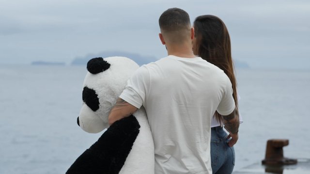Girl gets a toy panda from her boyfriend