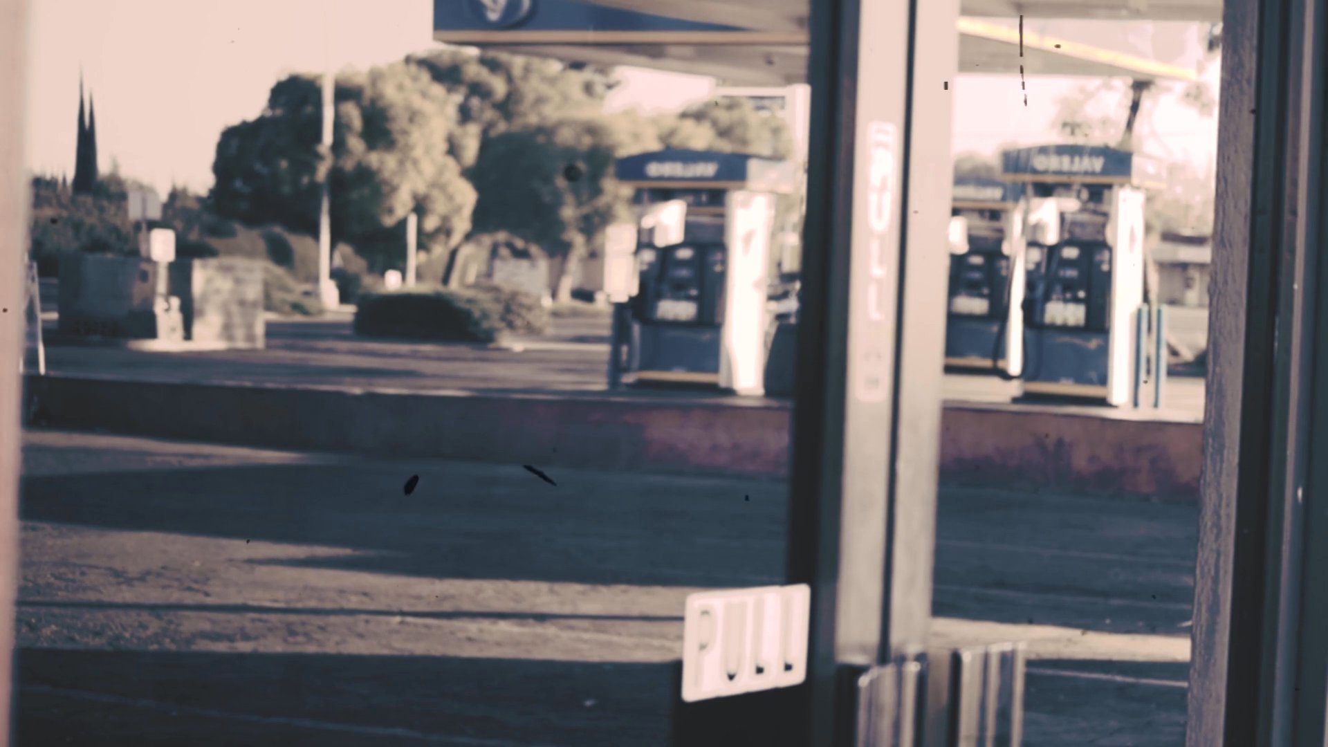 An establishing sequence captures the exterior of a diner named The Fruit, followed by a transition into the interior where a customer waits at the service counter.