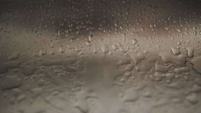 Water drops hitting the sink