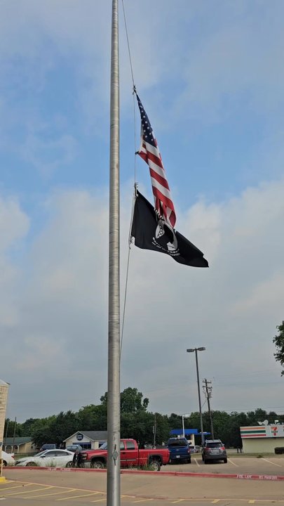 USPS - Flags flying at half staff in front of Post Office - Post Offices Near Me - Leander, Texas