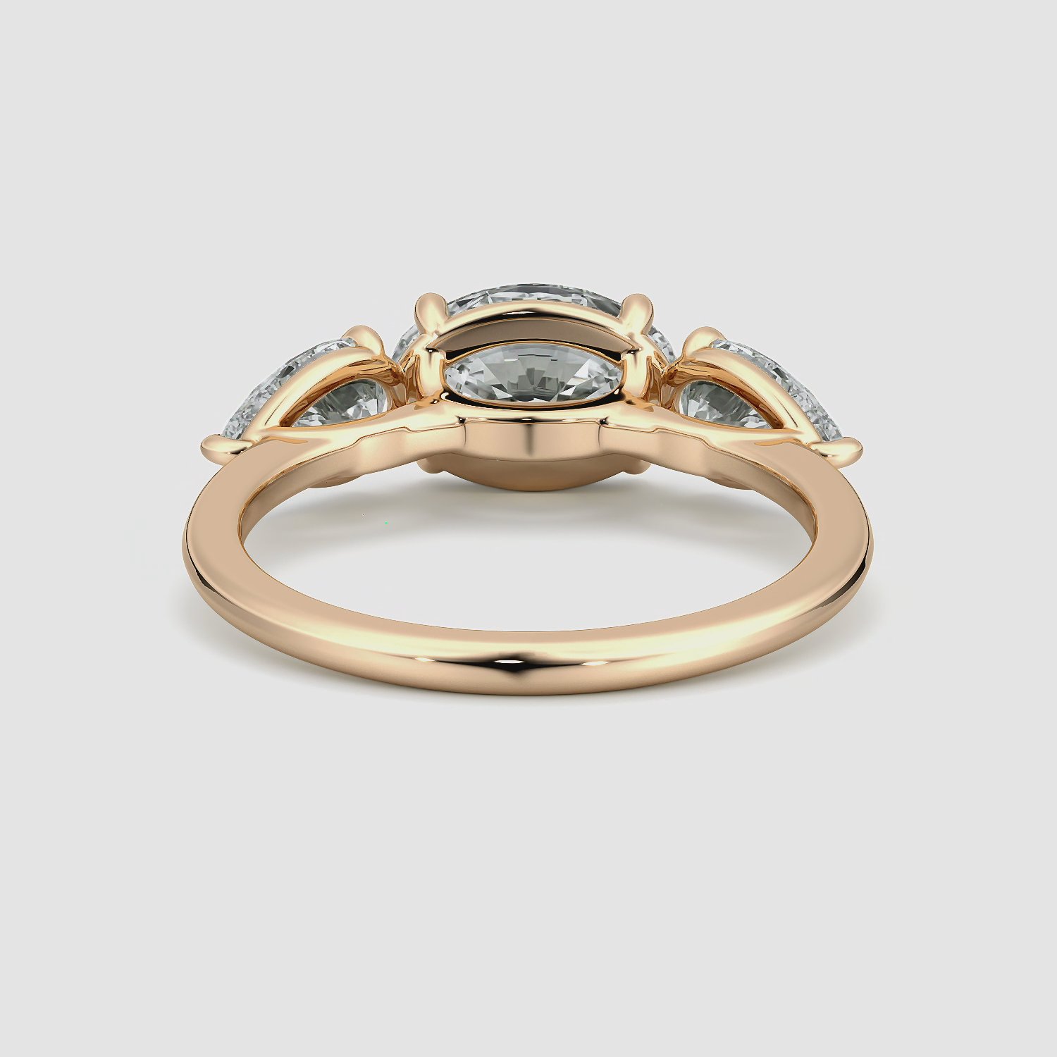 The Three Stone | Oval | 14k | Rose Gold | bandAccent: Plain | diamondOrientation: horizontal | sideStoneCarat: 0.50ct | sideStoneShape: Pear | caratWeight: other
