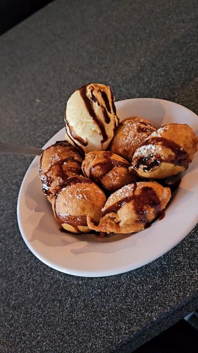 Village Grill - A video clip of The Fried Oreos with a scoop of vanilla ice cream dessert. - Dive Bars Near Me - Roanoke, Virginia