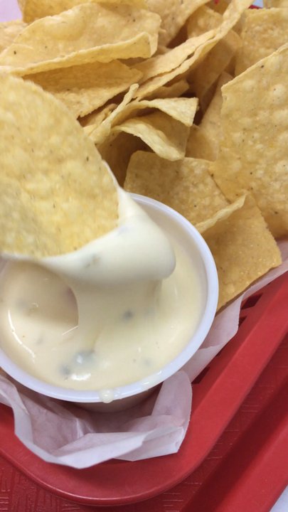 Oscar's Authentic Mexican Grill - That first dip of queso - Mexican Near Me - Olathe, Kansas