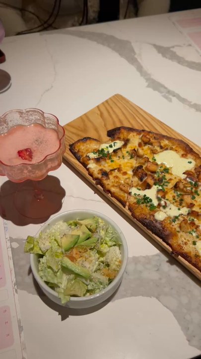 Leela's Wine Bar - Trophy Club - Buffalo chicken pizza with a small Caesar salad and pinkies up cocktail - Wine Bars Near Me - Trophy Club, Texas