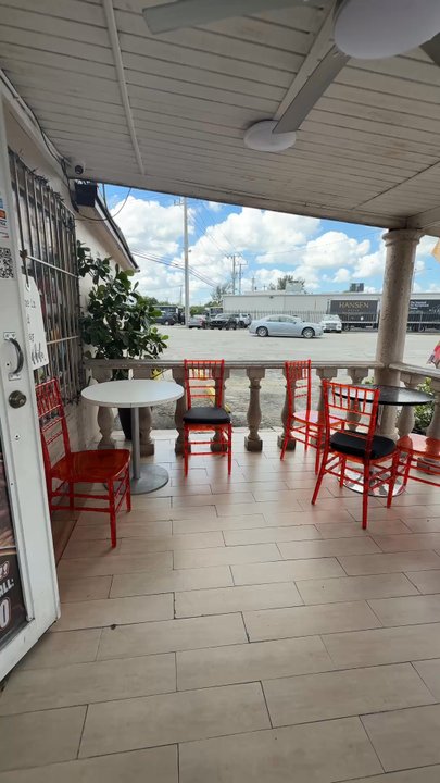 Dc2win Cafe Restaurant - Dining area outside in front - Dominican Near Me - Opa-locka, Florida