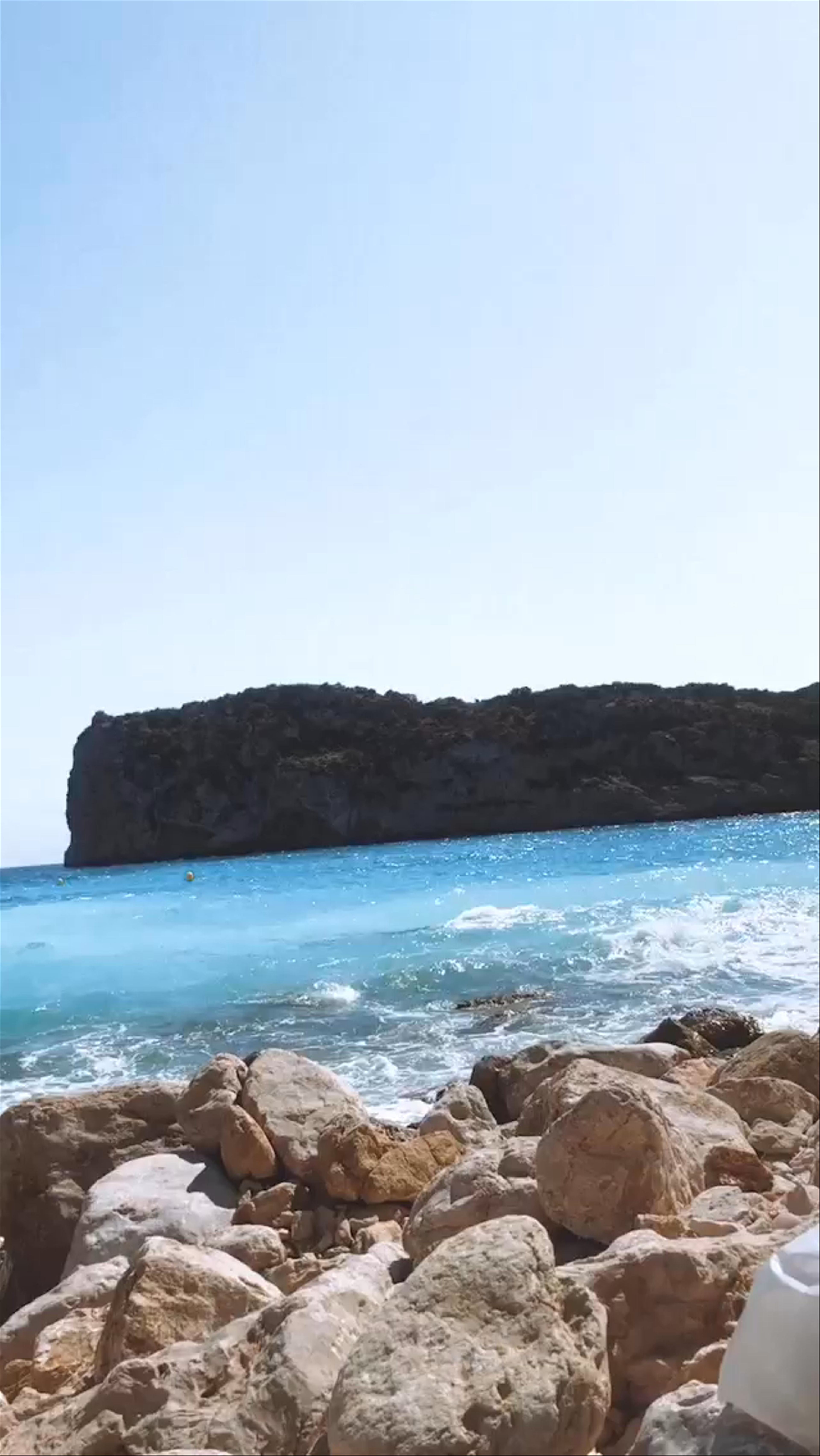 Platja la Barraca: Serene Rocky Shoreline in Badalona, Spain