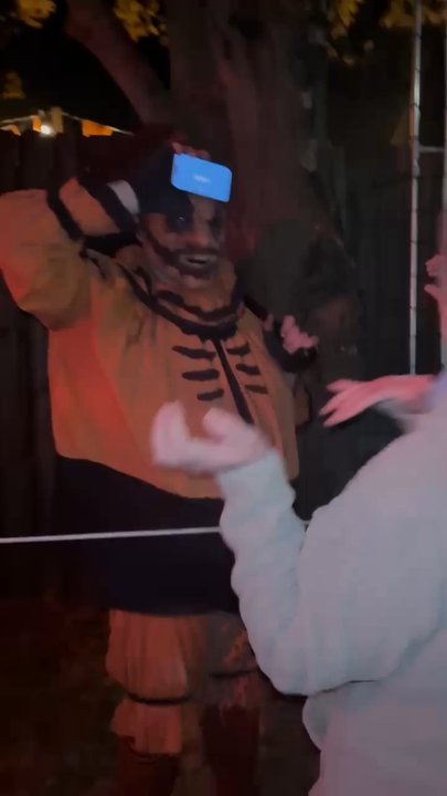 Dent School House - The Pumpkin Smasher (a "line crawler" actor who entertains the queue) playing charades with guests - Haunted Houses Near Me - Cincinnati, Ohio